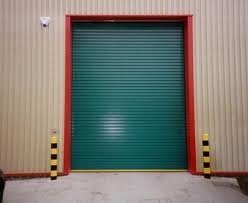Green roller shutter warehouse door